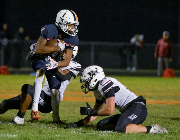 Oswego's Jeremiah Cain (1) runs the ball against Plainfield North in Oswego on Friday, Sept. 27, 2024. (Mark Black / The Beacon-News)