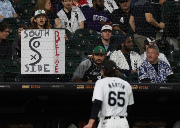 A fan holds up a sign in support of the White Sox as starting pitcher Davis Martin heads to the dugout after throwing against the Angels in the first inning at Guaranteed Rate Field on Sept. 25, 2024, in Chicago. (John J. Kim/Chicago Tribune)