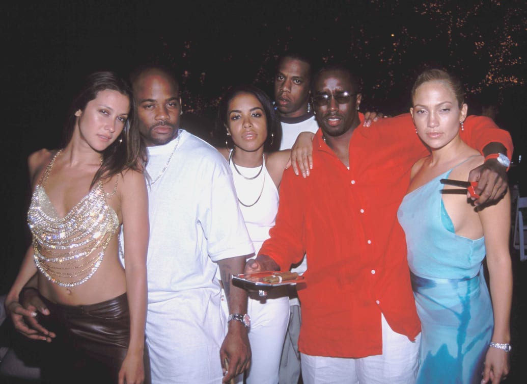 (L-R) Natane Adcock, Damon Dash, Aaliyah, Jay Z, Sean "Puff Daddy" Combs and Jennifer Lopez in 2000.