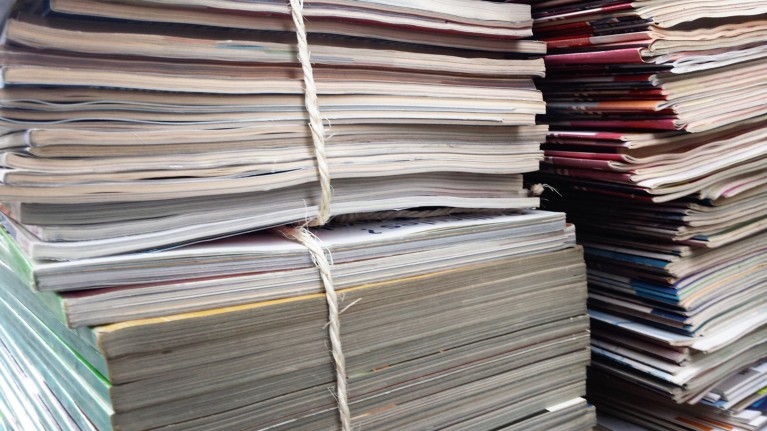 Close-up of a stack of magazines tied together with string