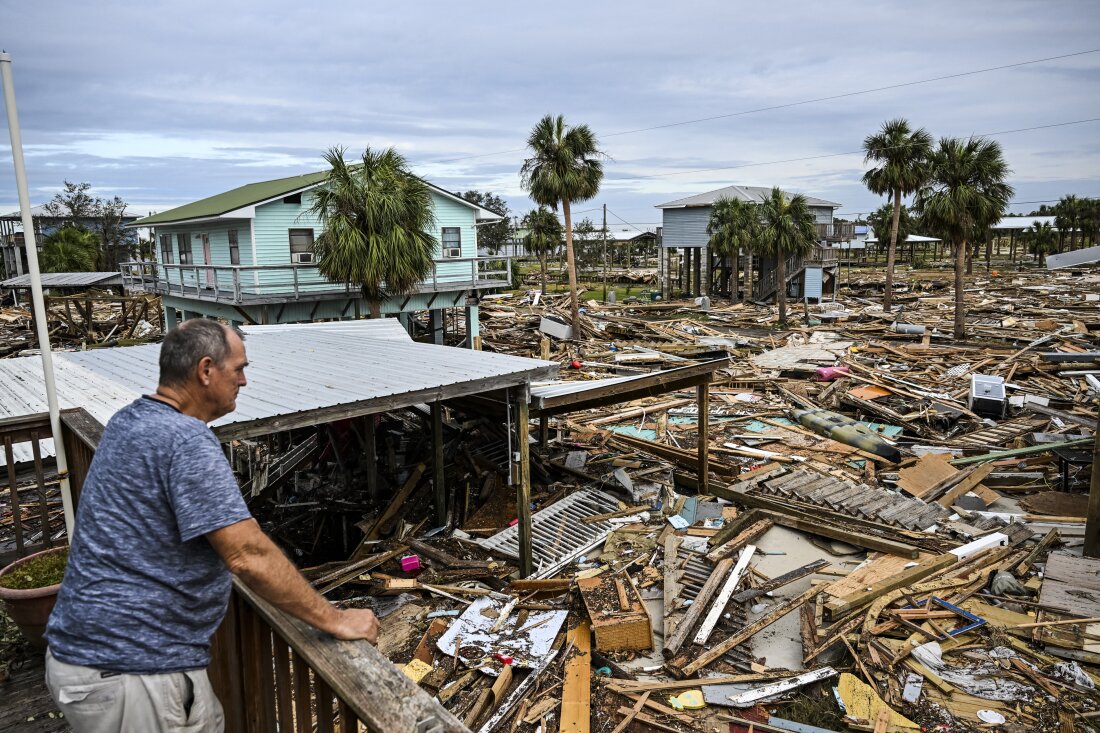 David Hester inspects damages of his house after Hurricane Helene made landfall in Horseshoe Beach, Fla., on Saturday.