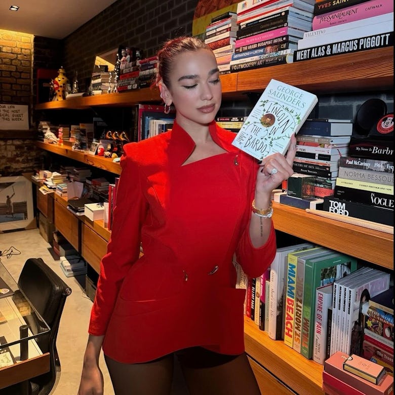 Dua Lipa in a vintage Mugler red coat.