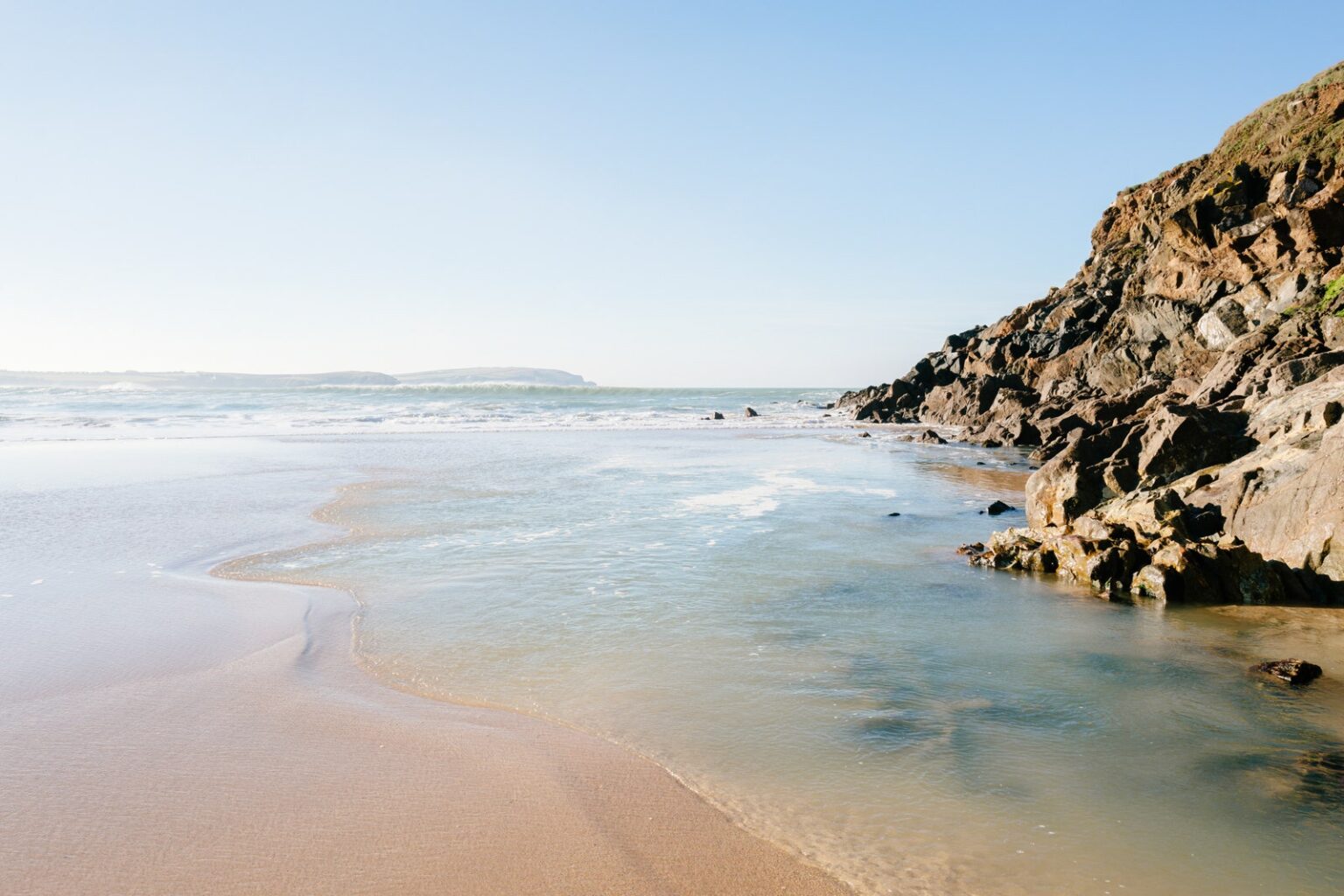 Image may contain Beach Coast Nature Outdoors Sea Shoreline Water Promontory Scenery Landscape and Rock