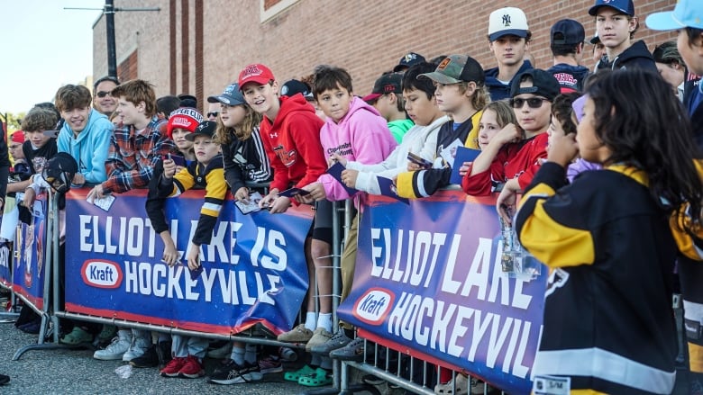 Young people cheering.