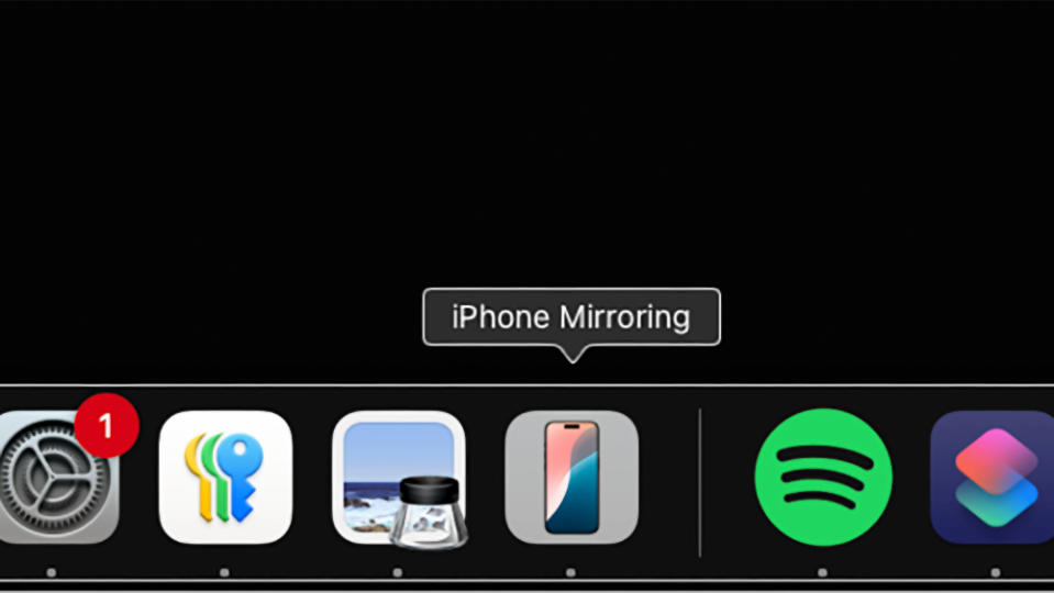 Screenshot of the iPhone Mirroring app icon in the macOS dock. Other apps flank it to the left and right.