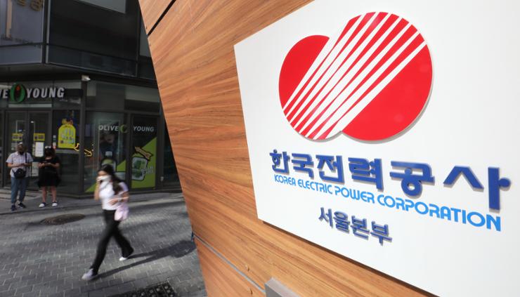 A person passes by the headquarters of Korea Electric Power (KEPCO) in Seoul, Aug. 16, 2022. Newsis