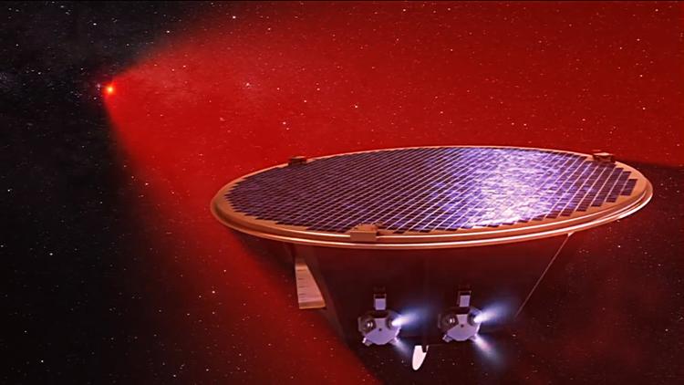 An artist's concept of a LISA spacecraft receiving laser light from one of its partners.