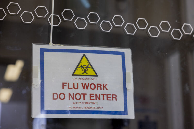 A warning sign outside a laboratory testing the H5N1 bird flu virus at The Pirbright Institute in Woking, UK, on Monday, March 13, 2023.