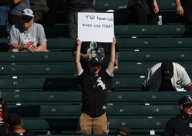 A fan holds a sign in the left-field bleachers during the seventh inning between the White Sox and Angels at Guaranteed Rate Field on Sept. 26, 2024, in Chicago. (John J. Kim/Chicago Tribune)