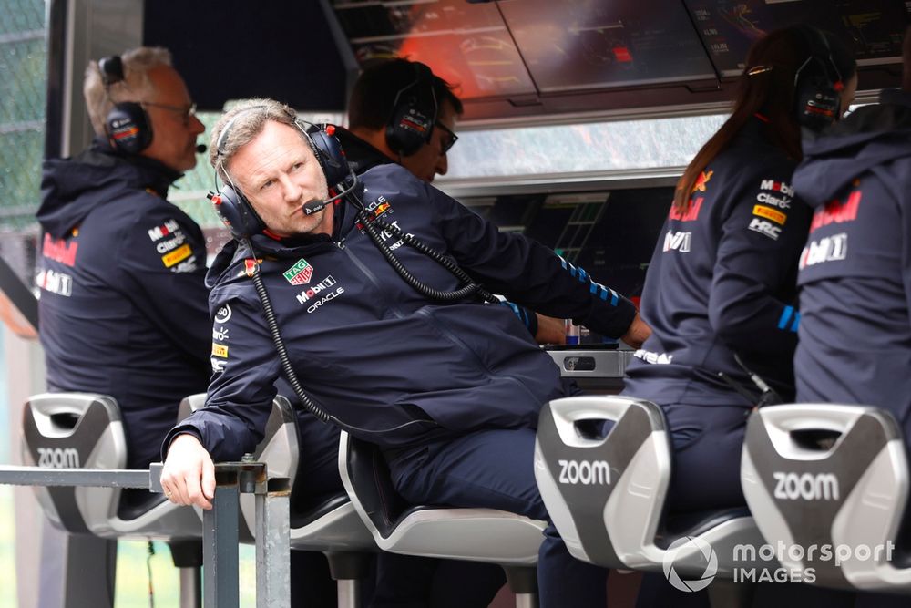 Christian Horner, Team Principal, Red Bull Racing, looks down the pit lane while sitting on the pit wall