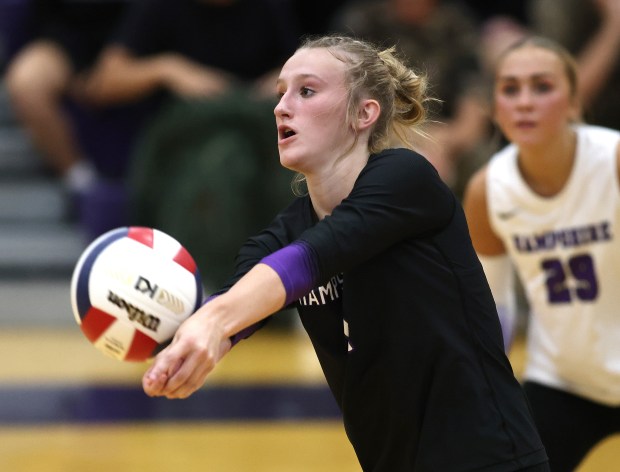 Hampshire's Elizabeth King (1) sets against Burlington Central during a Fox Valley Conference game on Thursday, Sept. 19, 2024 in Hampshire. (H. Rick Bamman / The Beacon News)