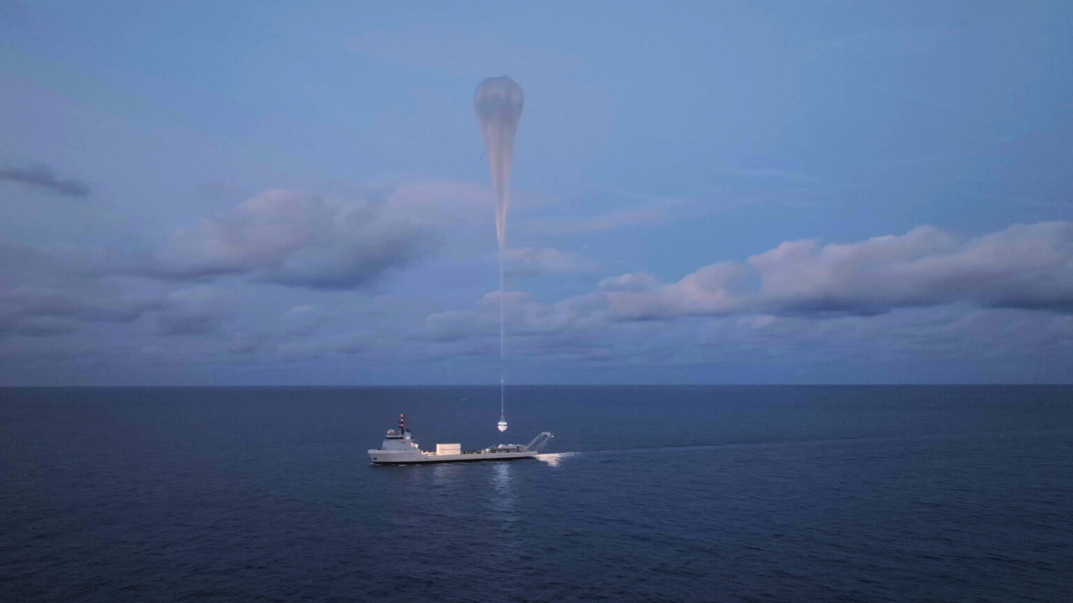 A vast ocean below a partly cloud sky. In the center, a long, flat boat with tall bow command center floats below a tiny point of bright light, hanging just above the deck from a long thin line attached to an enormous pale balloon towering above.