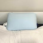 Casper Hybrid Pillow with Snow Technology on top of white sheets