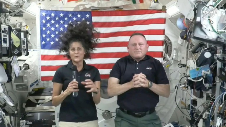 Image a NASA video of astronauts Suni Williams, left, and Butch Wilmore during a news conference aboard the International Space Station.