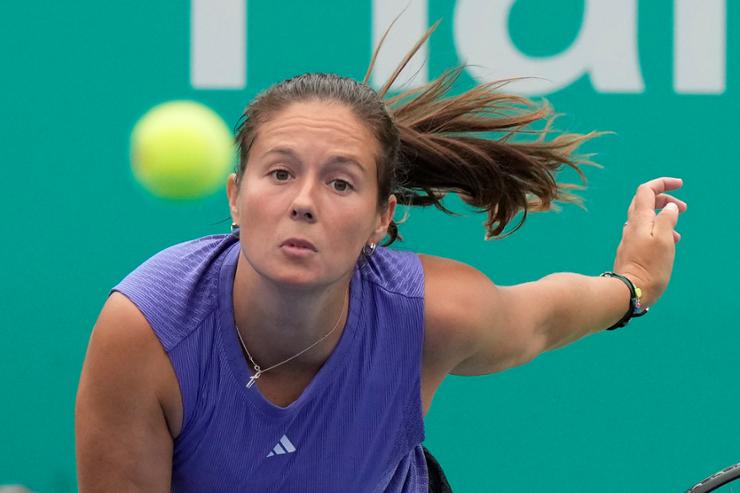 Daria Kasatkina of Russia returns a shot to Emma Raducanu of Britain during their quarterfinal match of the Korea Open tennis championships in Seoul, Sept. 21. AP-Yonhap