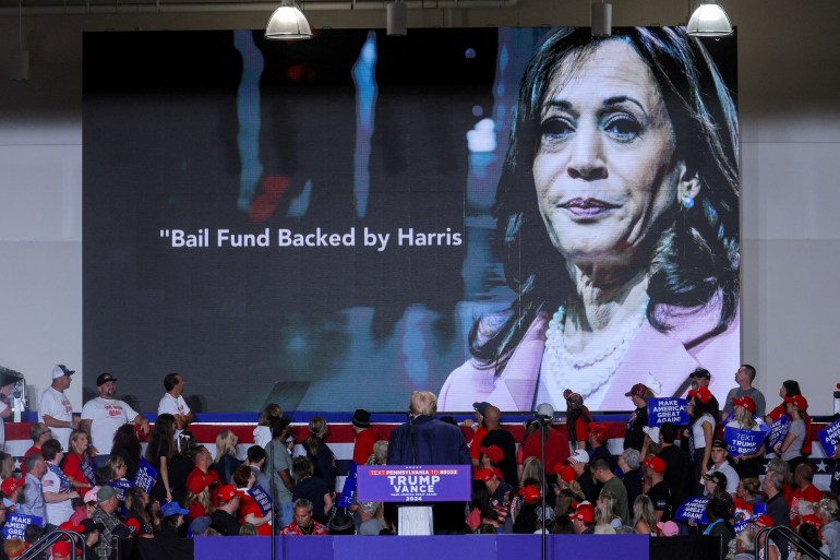 Donald Trump watches a campaign video attacking Democratic Kamala Harris