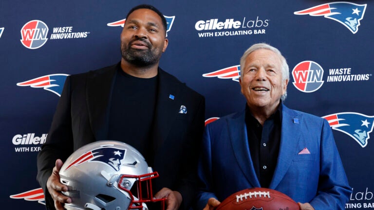 New England Patriots head coach Jerod Mayo, left, and owner Robert Kraft pose for photos after Mayo’s introductory press conference at Gillette Stadium.