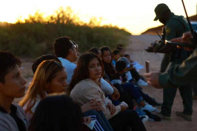 Migrants are detained by U.S. Border Patrol agents after crossing into the United States from Mexico, in Sunland Park, New Mexico, U.S. August 2, 2024. REUTERS/Jose Luis Gonzalez