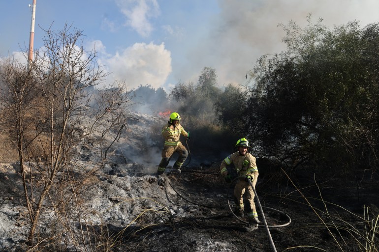 Responders put out a fire in the area of Lod, near Tel Aviv