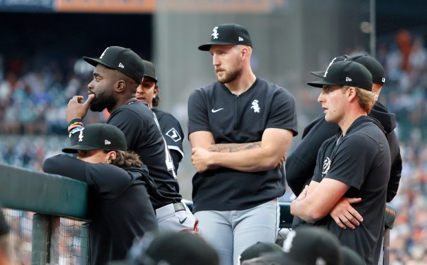 Bryan Ramos #44 (L), Garrett Crochet #45 (C) and Jonathan Cannon #48 (R) of the Chicago White Sox and others look on during the final game of the year, against the Detroit Tigers, at Comerica Park on Sept. 29, 2024 in Detroit, Michigan. (Photo by Duane Burleson/Getty Images)