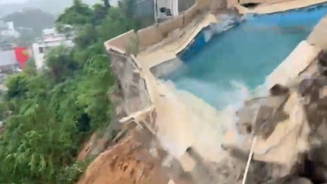 Moment pool collapses as Acapulco hit by landslides and floods in wake of Hurricane John – video