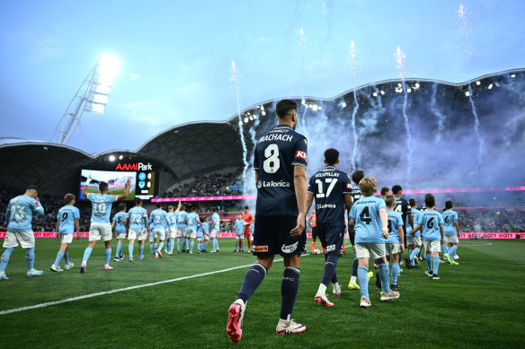 Victory and City walk out for the Melbourne derby.