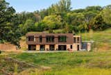 The clients wished to build their home with resilient materials which referenced the agricultural history of the land and blended in with the natural colors and textures of the surrounding landscape.