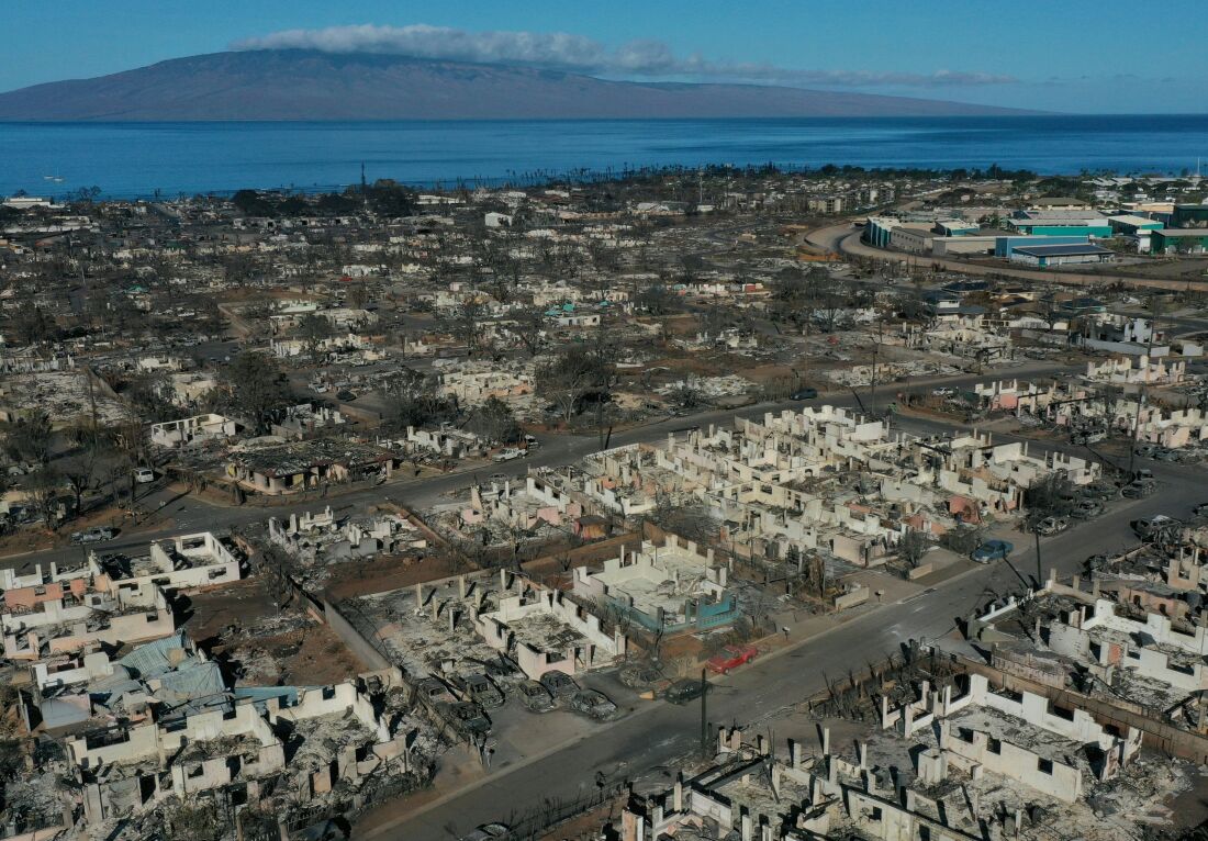 An aerial image shows destroyed homes and vehicles after a wind driven wildfire burned from the hills through neighborhoods to the Pacific Ocean, as seen in the aftermath of the Maui wildfires in Lahaina, Hawaii, on Aug. 17, 2023.