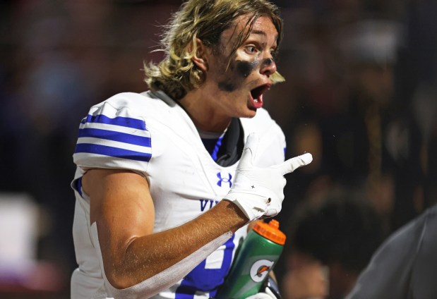 Geneva's Finnegan Weppner (8) pumps up his teammates after his third quarter touchdown against Batavia during a DuKane Conference game in Batavia on Friday, Oct. 4, 2024.(H. Rick Bamman / The Beacon-News)