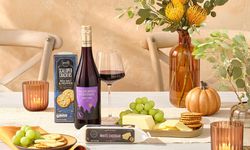 One of ALDI's ten dollar Thanksgiving bundles, which includes wine, white cheddar and crackers.