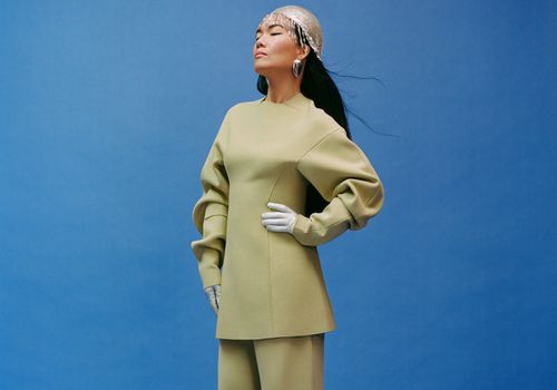 Ali Wong wears a light green top and pants for InStyle's October Issue