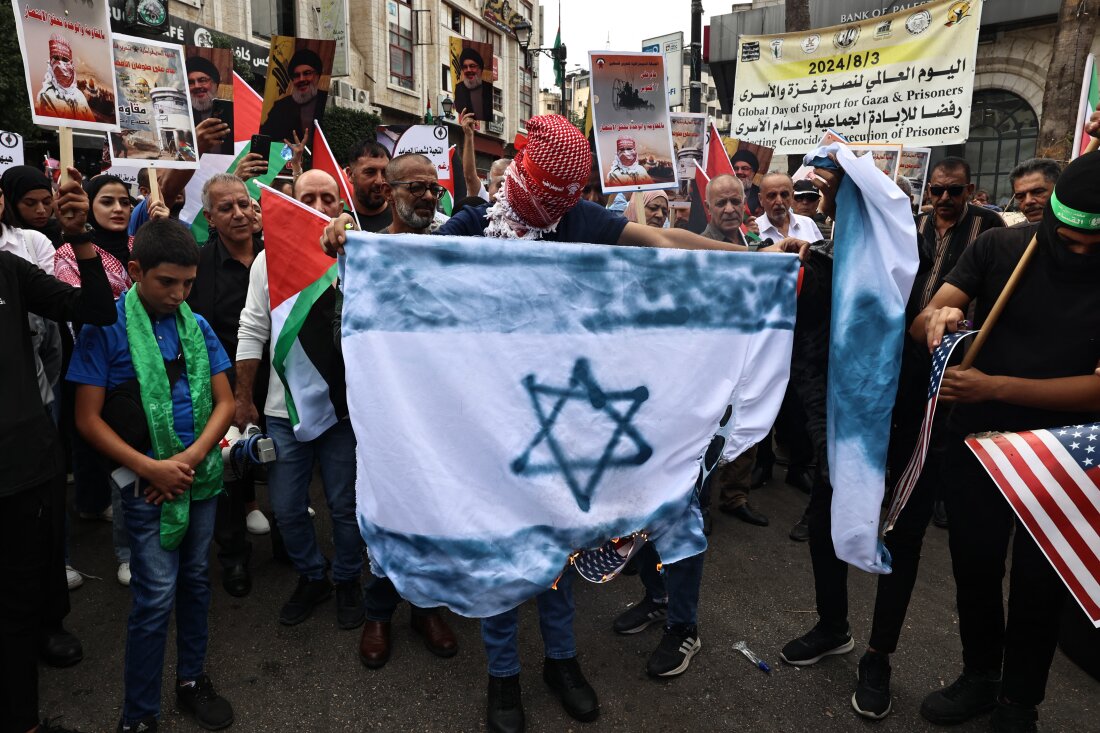 Palestinian protesters attend a rally to mark the first anniversary of Palestinian militant group Hamas' Oct. 7, 2023, attack on Israel, in Ramallah in the occupied West Bank on Monday.