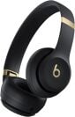 Beats Solo 4 headphones in black and gold