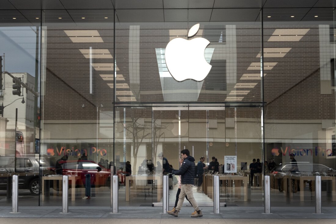 The Consumer Finance Protection Bureau has fined Apple and Goldman Sachs for mishandling disputed charges and misleading customers. The Apple logo hangs in front of an Apple store in Chicago in March.