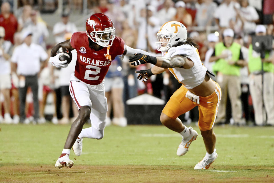 Arkansas wide receiver Andrew Armstrong (2) tries to get past Tennessee linebacker Keenan Pili (11) during the first half of an NCAA college football game, Saturday, Oct. 5, 2024, in Fayetteville, Ark. (AP Photo/Michael Woods)