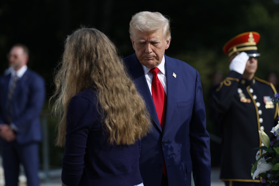 Former President Donald Trump stands alongside appears at a wreath laying ceremony at the Tomb of the Unknown Soldier at Arlington National Cemetery on August 26.