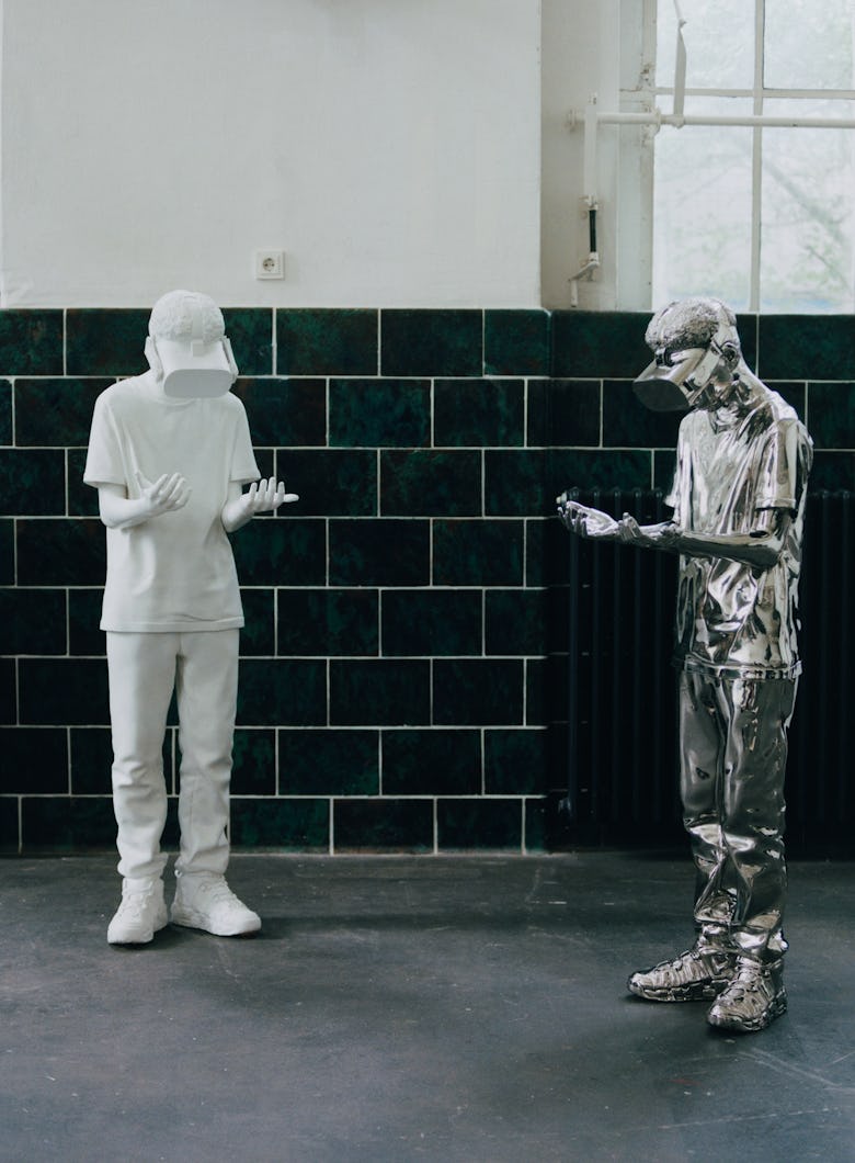 Art work of a white and silver statue by Elmgreen & Dragset