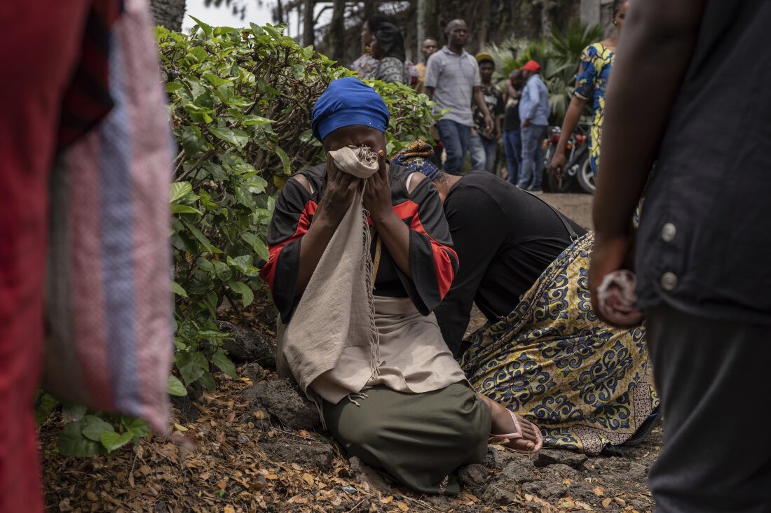 Women grieve at the port of Goma, Democratic Republic of Congo, after a ferry carrying hundreds capsized on arrival Thursday.