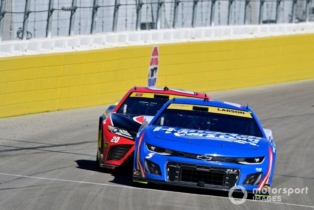 Kyle Larson being chased by Christopher Bell in the run to the finish line in 2023.