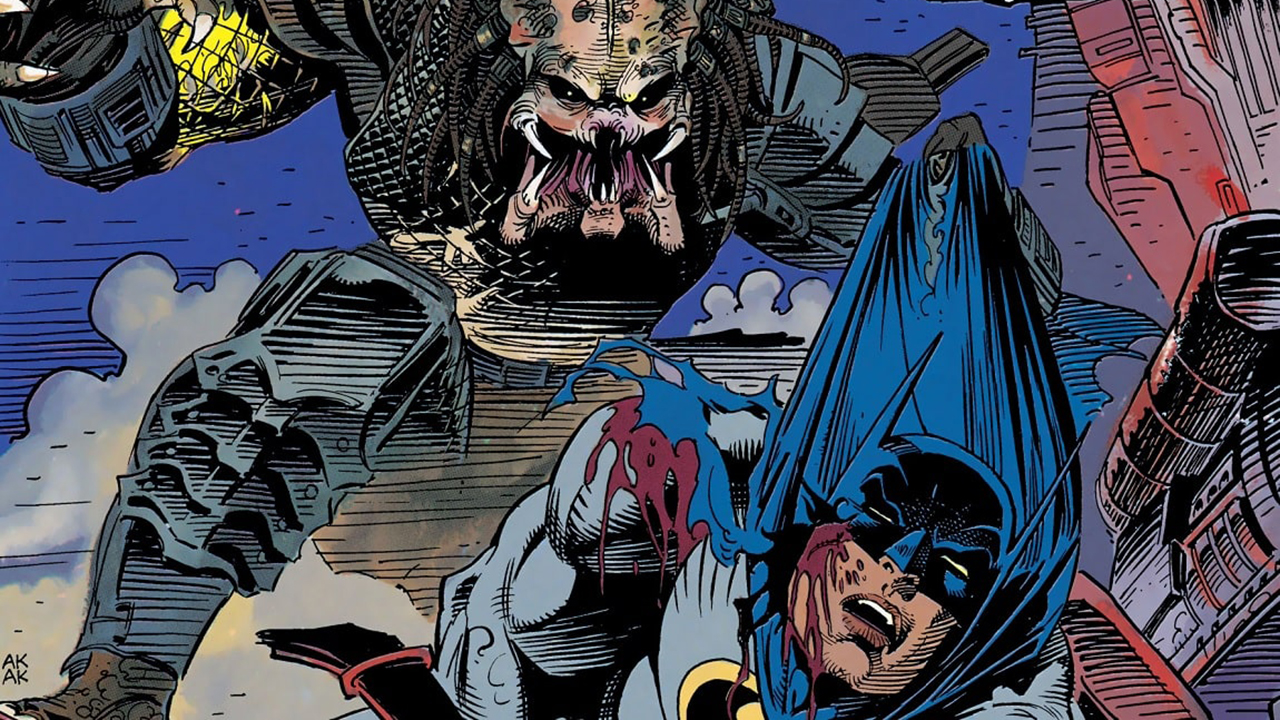 Image from the Batman vs. Predator comic. The creature Predator is yanking a bloody and beat-up Batman up by his cape.