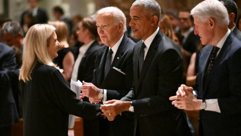 Kerry Kennedy is greeted by President Joe Biden, former President Barack Obama and former President Bill Clinton during a memorial service for her mother Ethel Kennedy on October 16, 2024, at the Cathedral of St. Matthew the Apostle in Washington, DC.