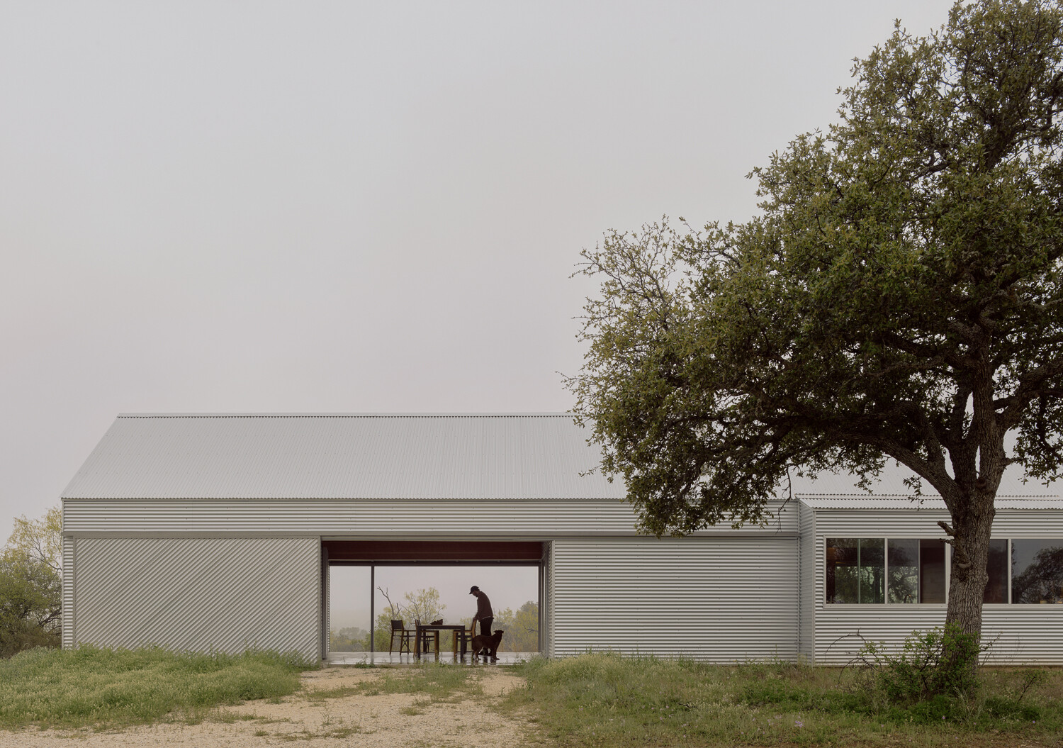 An outdoor breezeway between the storage shed and the main house is ideal for outdoor dining.