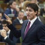 Canada Prime Minister Justin Trudeau rises during Question Period in Ottawa, Tuesday, Oct. 22, 2024. (Adrian Wyld/The Canadian Press via AP)