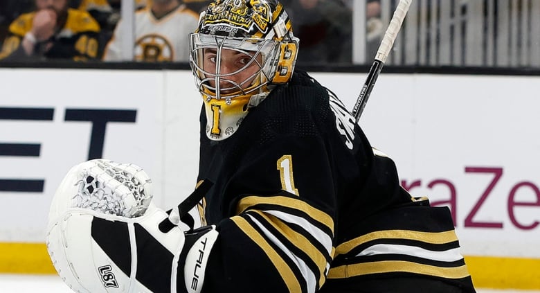 Boston Bruins goaltender Jeremy Swayman attempts to make a save a Stanley Cup playoff game against the visiting Florida Panthers on May 12, 2024.