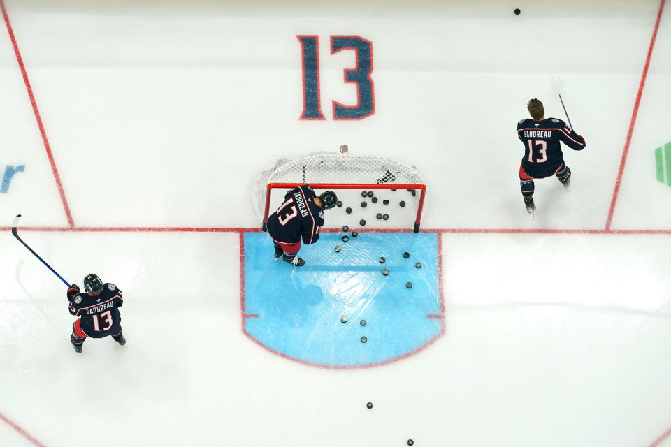 COLUMBUS, OHIO - OCTOBER 15: Columbus Blue Jackets players warm up before the game against the Florida Panthers at Nationwide Arena on October 15, 2024 in Columbus, Ohio. Players from both teams are wearing #13 in warm up jerseys in remembrance of Blue Jackets player Johnny Gaudreau, who along with his brother, was killed by a driver while biking in Salem County, New Jersey in August.  (Photo by Jason Mowry/Getty Images)