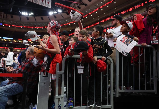 Youth Bulls fans wait for players before a preseason game against the Cavaliers at the United Center on Oct. 18, 2024, in Chicago. (John J. Kim/Chicago Tribune)