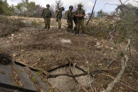 Israeli soldiers inspect what they claim is a Hezbollah tunnel found, according to the army, during an Israel Defense Forces media tour near Naqoura, southern Lebanon on Sunday.