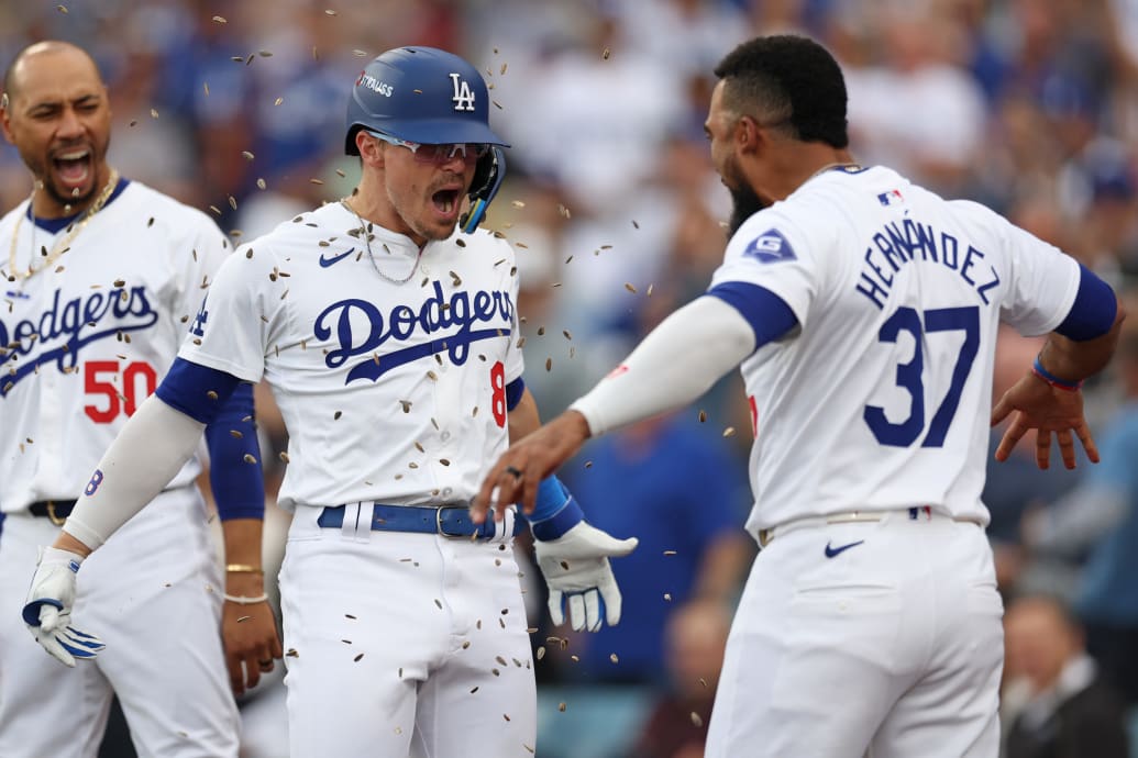 Enrique Hernández #8 of the Los Angeles Dodgers celebrates after his solo home run against the San Diego Padres with Teoscar Hernández #37