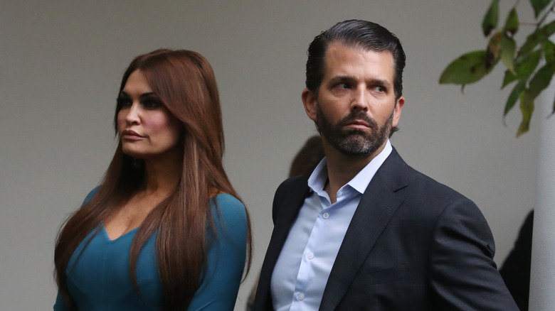 Kimberly Guilfoyle and Don Trump Jr. frowning