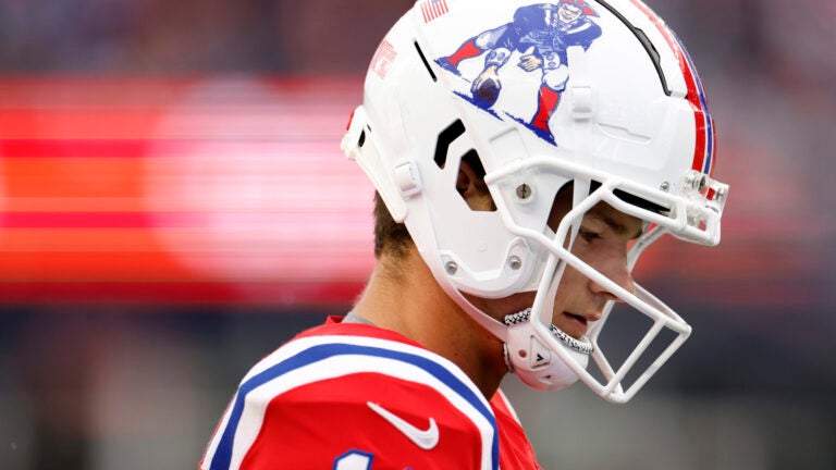 New England Patriots quarterback Drake Maye (10) walks onto the field during the fourth quarter at Gillette Stadium.